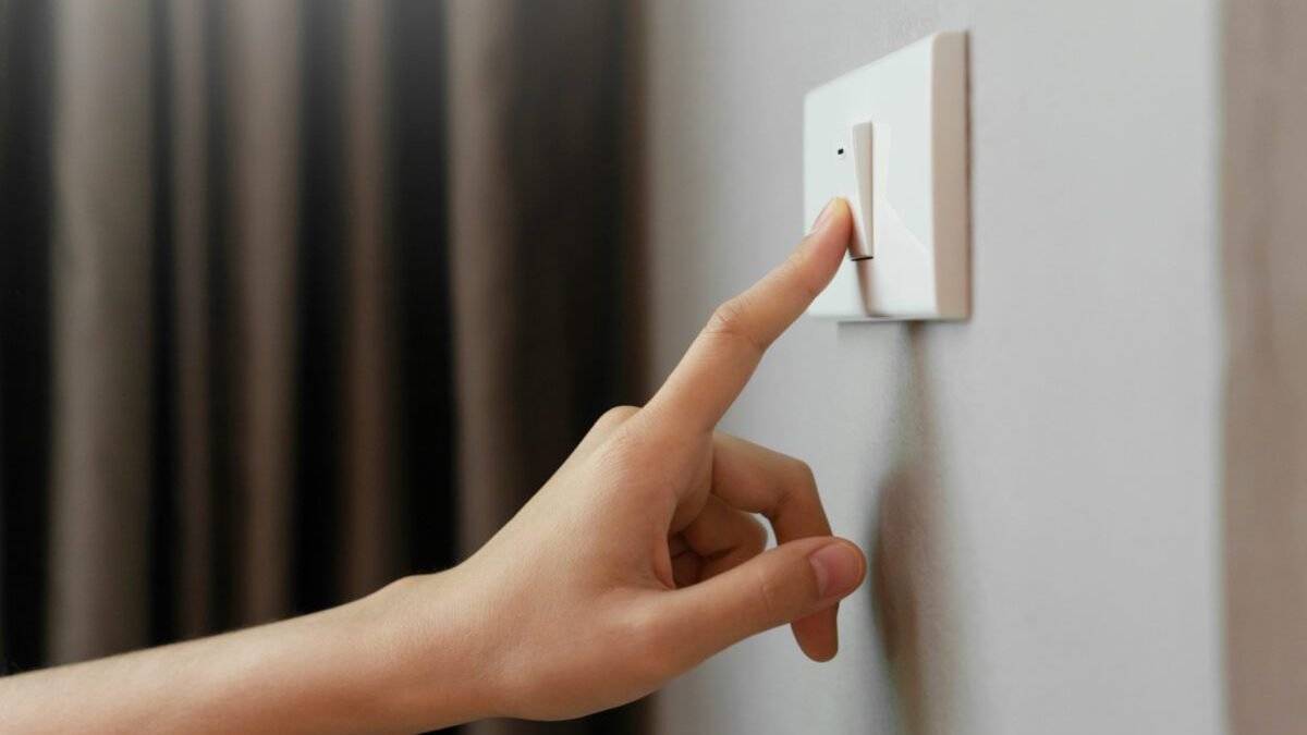 female-finger-is-turn-off-lighting-switch-1-scaled-1-1200x800